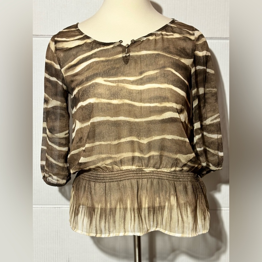Chico’s size 2 (18/20) animal print sheer top. Elastic above a ruffle hem brown